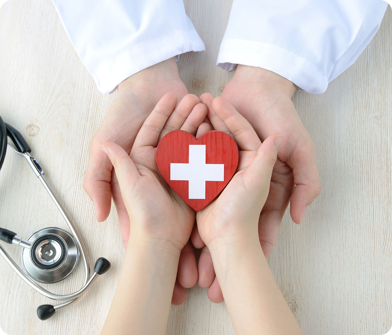 Hands cupping a healthcare cross symbol